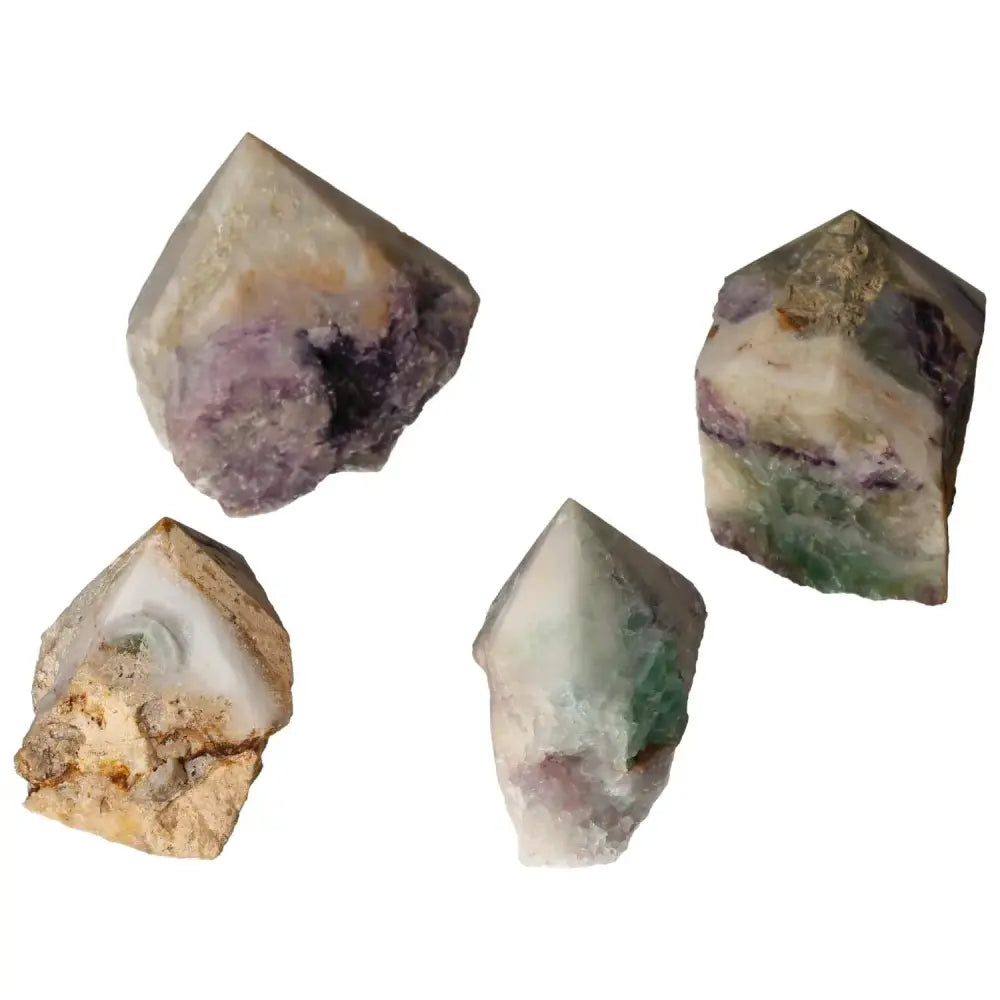 Collection of polished fluorite points in vibrant hues, enhancing mental faculties and promoting growth.
