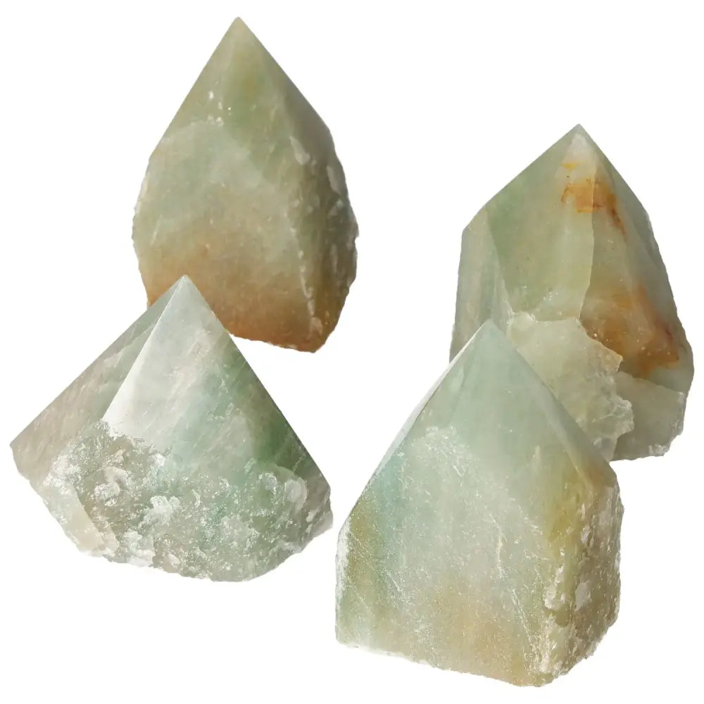 Four polished green quartz points with hematite, offering a blend of tranquility and grounding energy for spiritual enhancement.