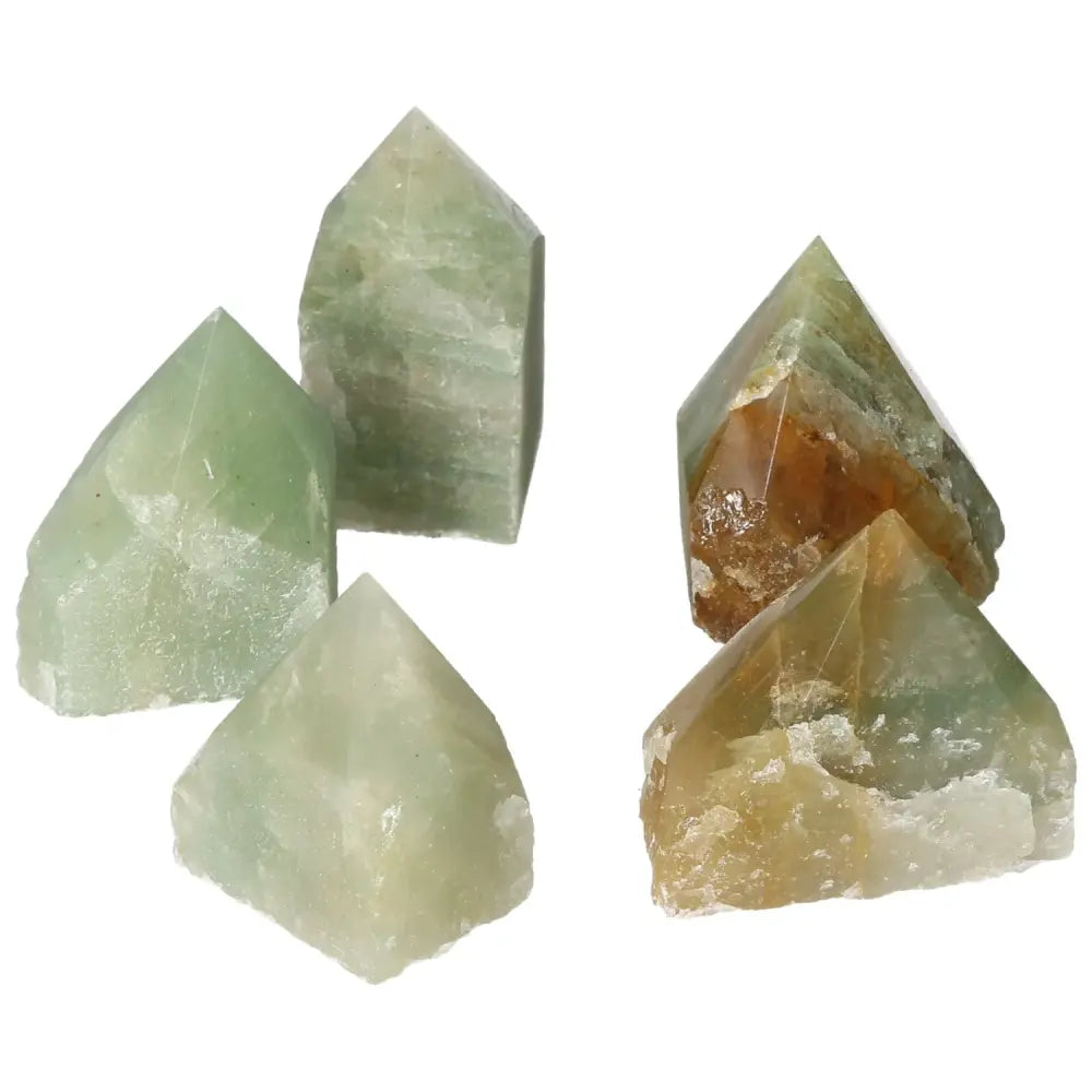 Polished green quartz points with hematite accents from Sylvia Crystals, showcasing exquisite craftsmanship and luxury.