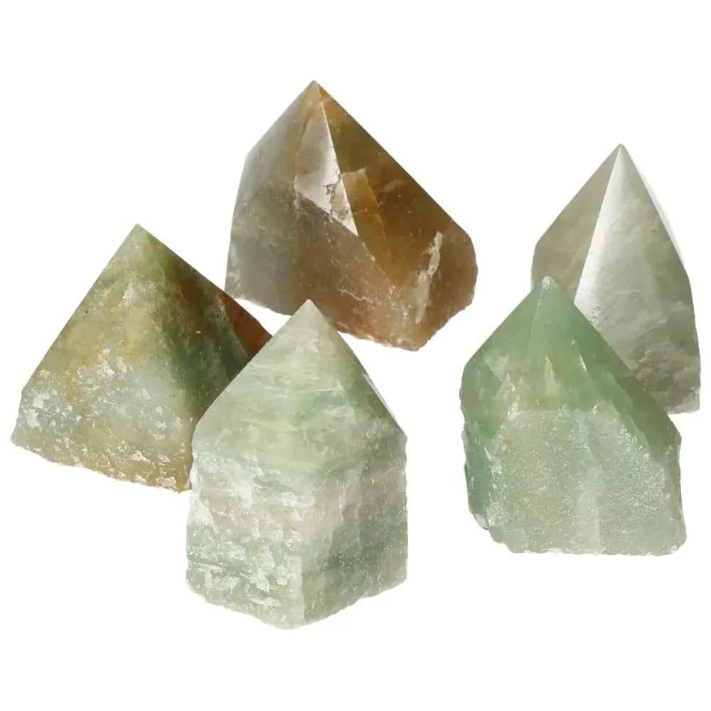 Selection of polished green quartz points with hematite accents, showcasing the quality of Sylvia Crystals' gemstones.