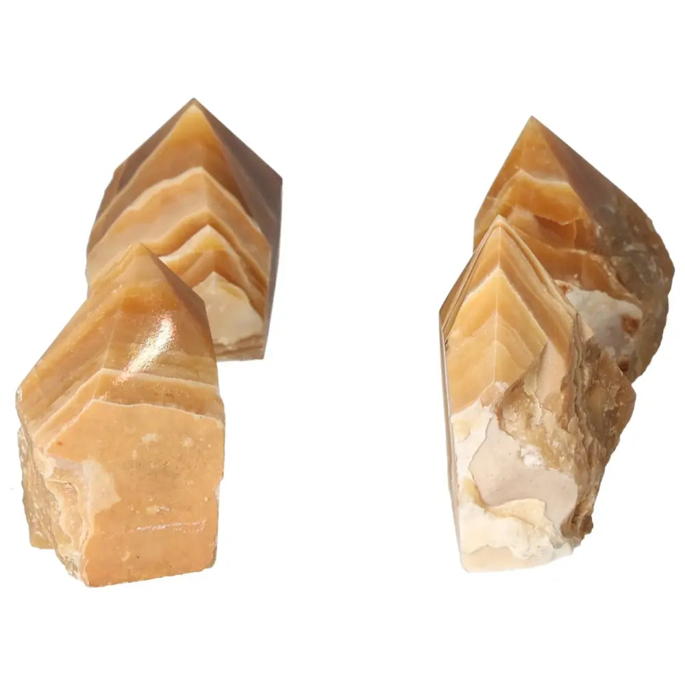 Polished Honey Calcite crystal points with golden hues, known for attracting prosperity and success, from Sylvia Crystals.