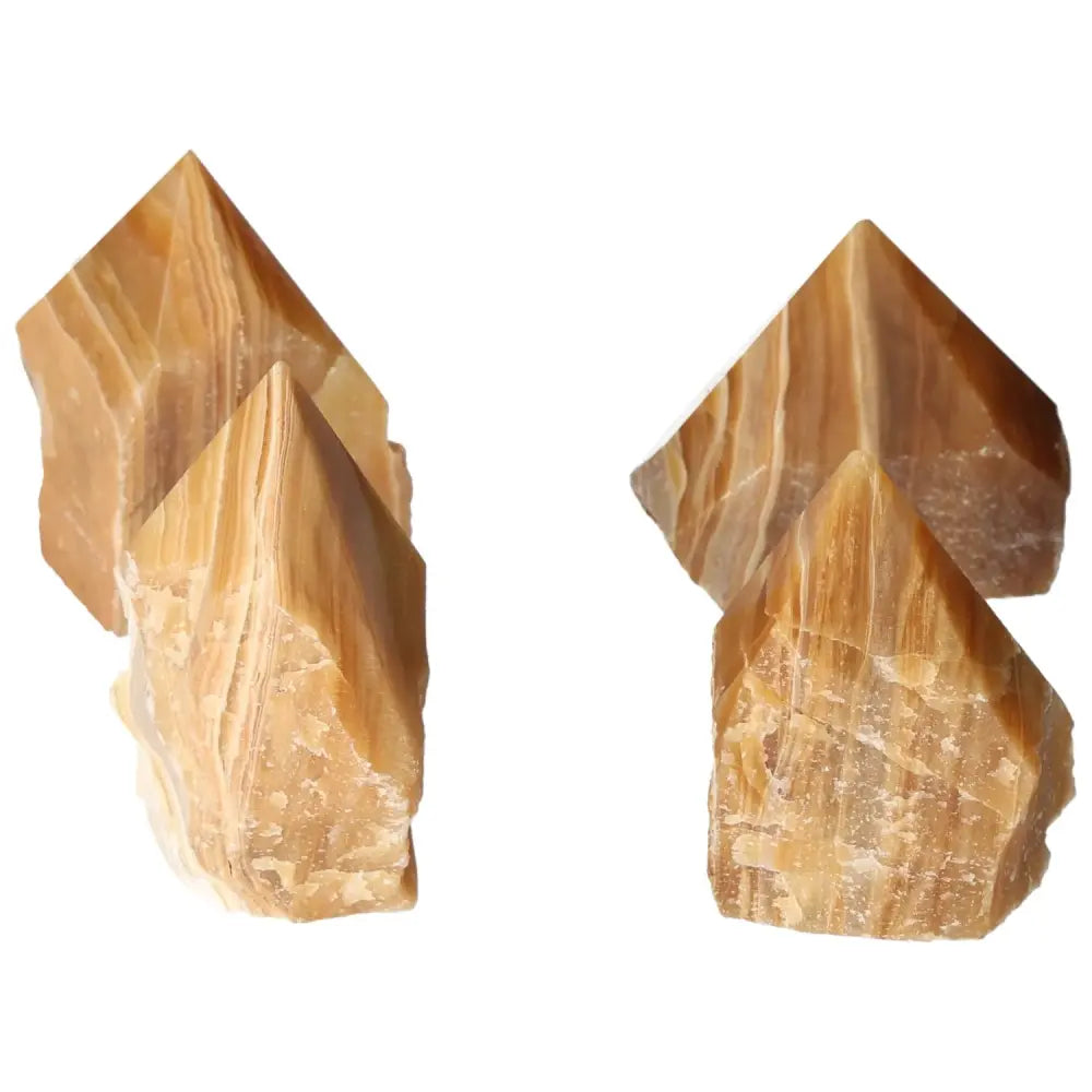 Polished point honey calcite crystals, radiating golden warmth and vibrant energy, ideal for manifestation and attracting prosperity.