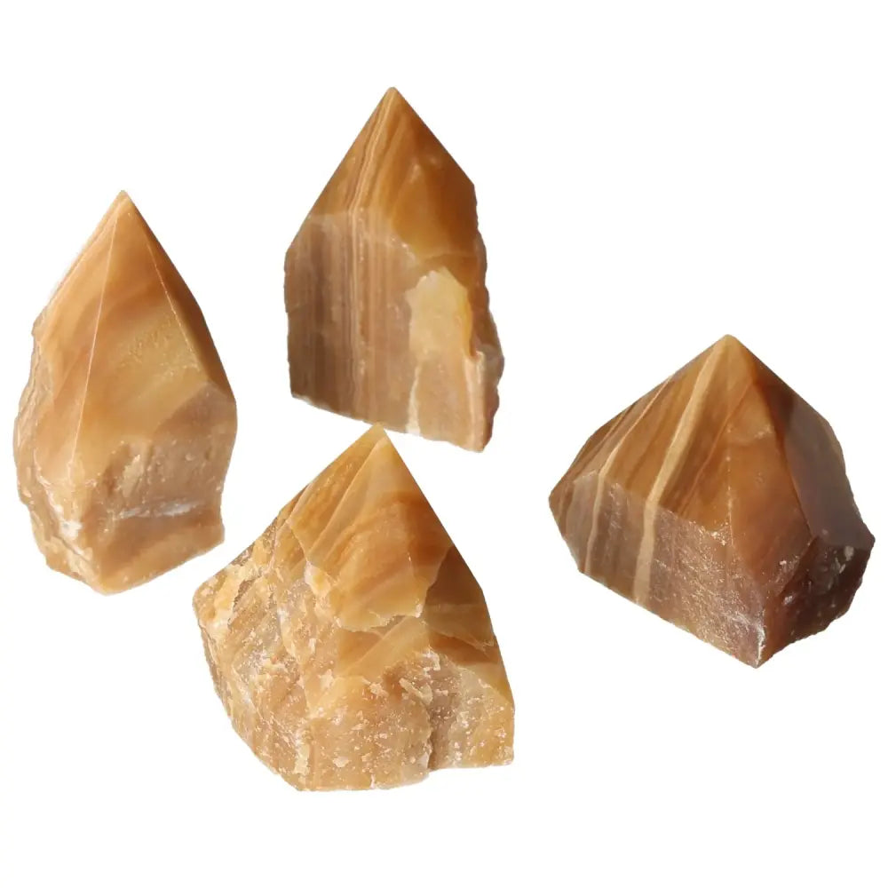 Polished Point Honey Calcite crystals radiating golden warmth, enhancing prosperity and success, from Sylvia Crystals' premium collection.