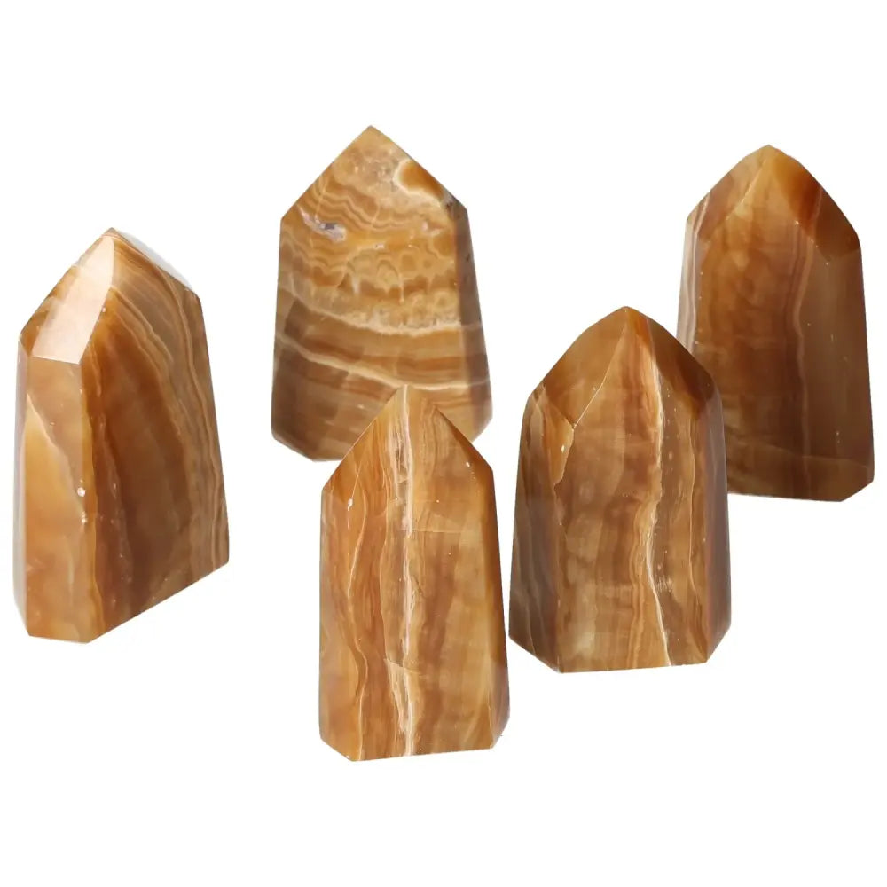 Polished Point Honey Calcite M crystals featuring warm honey hues, symbolizing prosperity and emotional healing, by Sylvia Crystals.
