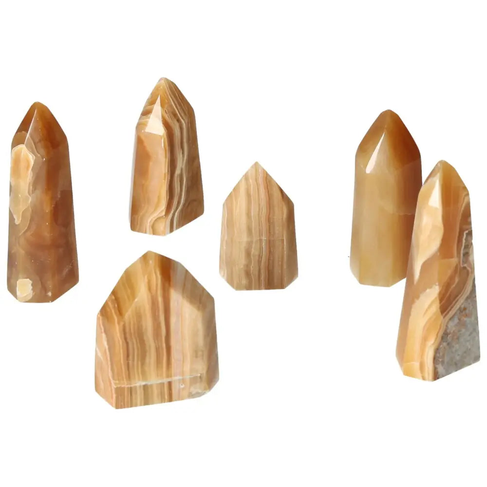 Polished Point Honey Calcite S crystals from Sylvia Crystals, symbolizing prosperity, abundance, and positive transformation.