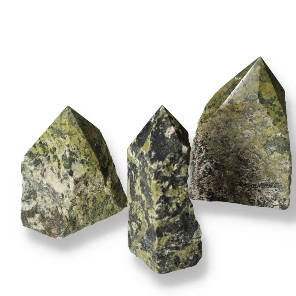 Three polished jadeite L crystals showcasing intricate patterns and green hues, symbolizing elegance and prosperity from Sylvia Crystals.