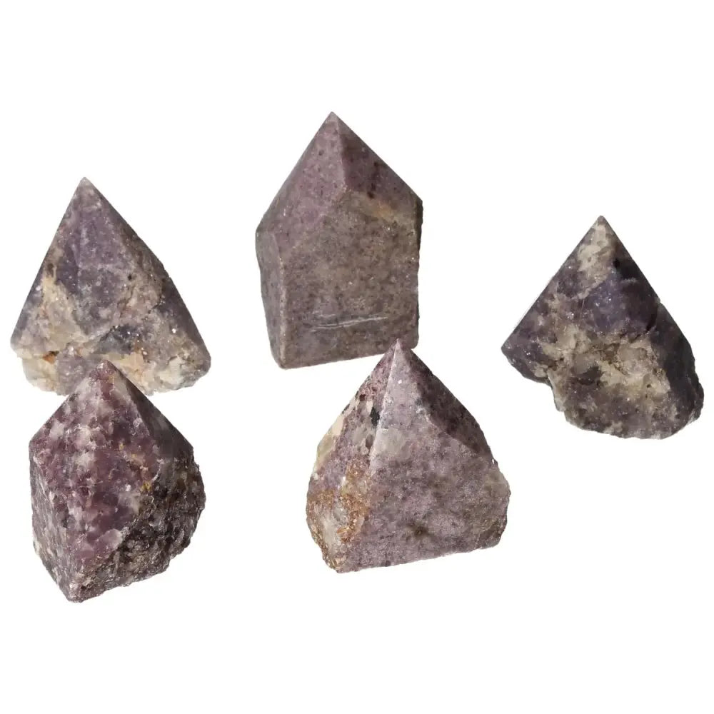 Collection of polished Lepidolite gemstones in pyramid shapes from Sylvia Crystals, known for anxiety reduction and emotional balance.
