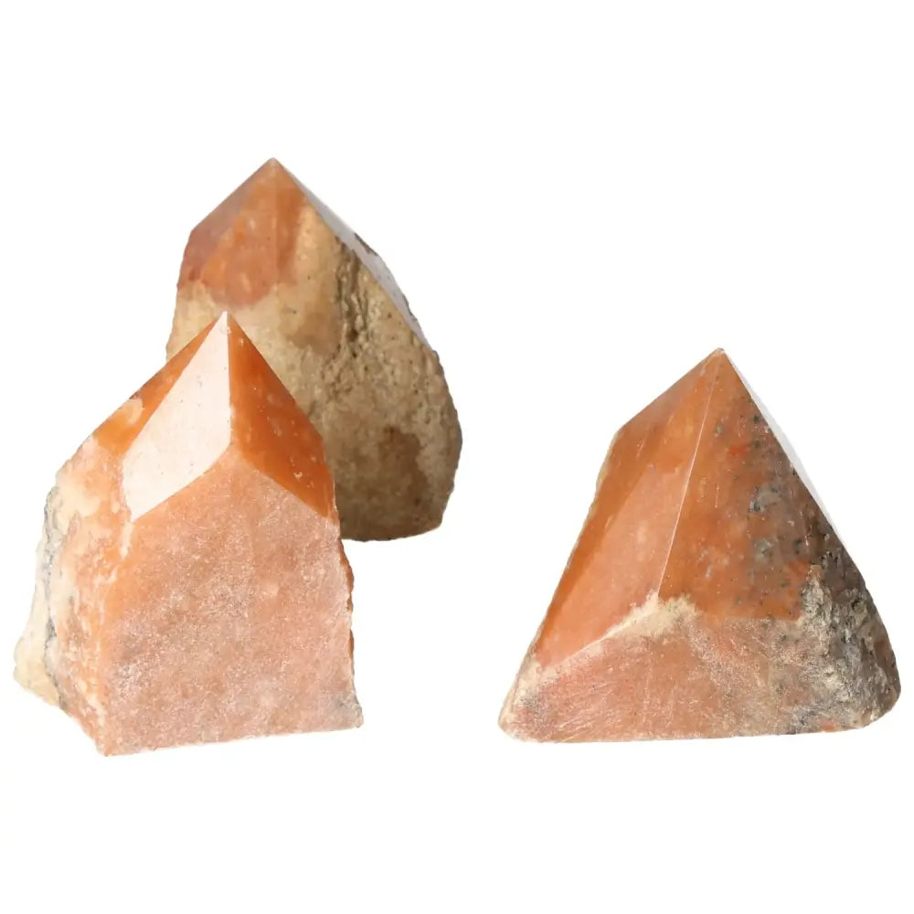Set of polished point orange calcite bi-color crystals from Sylvia Crystals, showcasing vibrant hues and natural artistry.
