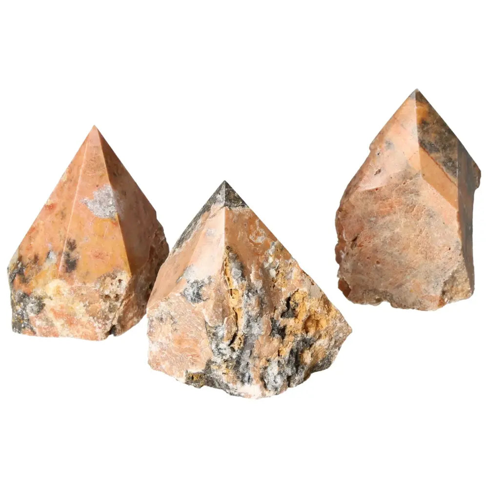 Collection of three Polished Point Orquidea Calcite L crystals from Sylvia Crystals, showcasing a unique blend of colors and textures.