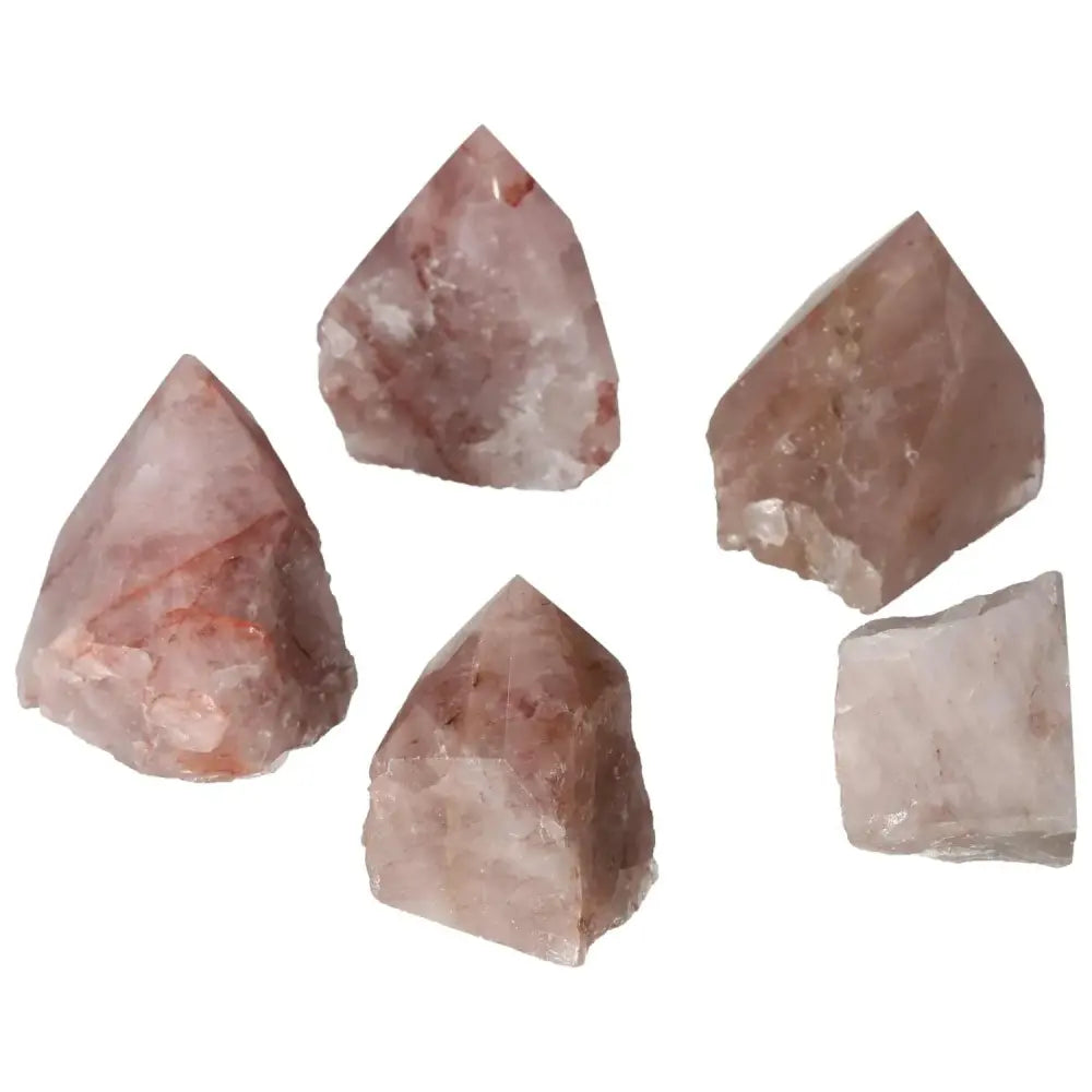 Polished Point Pink Hematoide S gemstones arranged in a group, showcasing their radiant pink hues and polished finish for luxury and wellness.