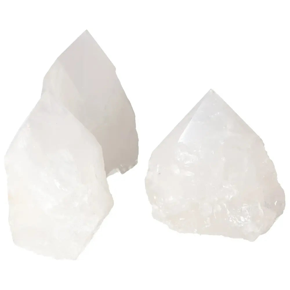Three polished point quartz crystals with a luminous, clear surface, showcasing premium quality and potent purification properties.