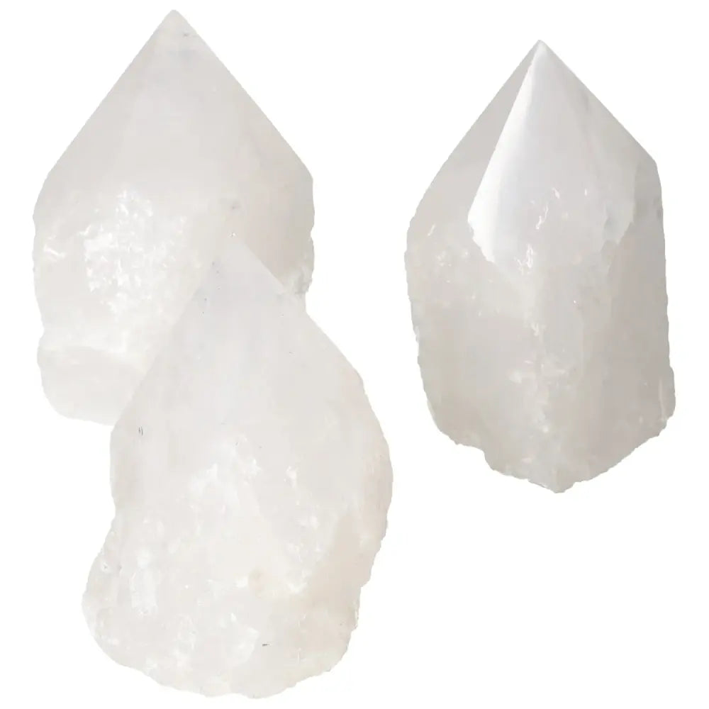 Polished Point Quartz L crystals from Sylvia Crystals, known for purification and visual splendor, captured in a pristine arrangement.