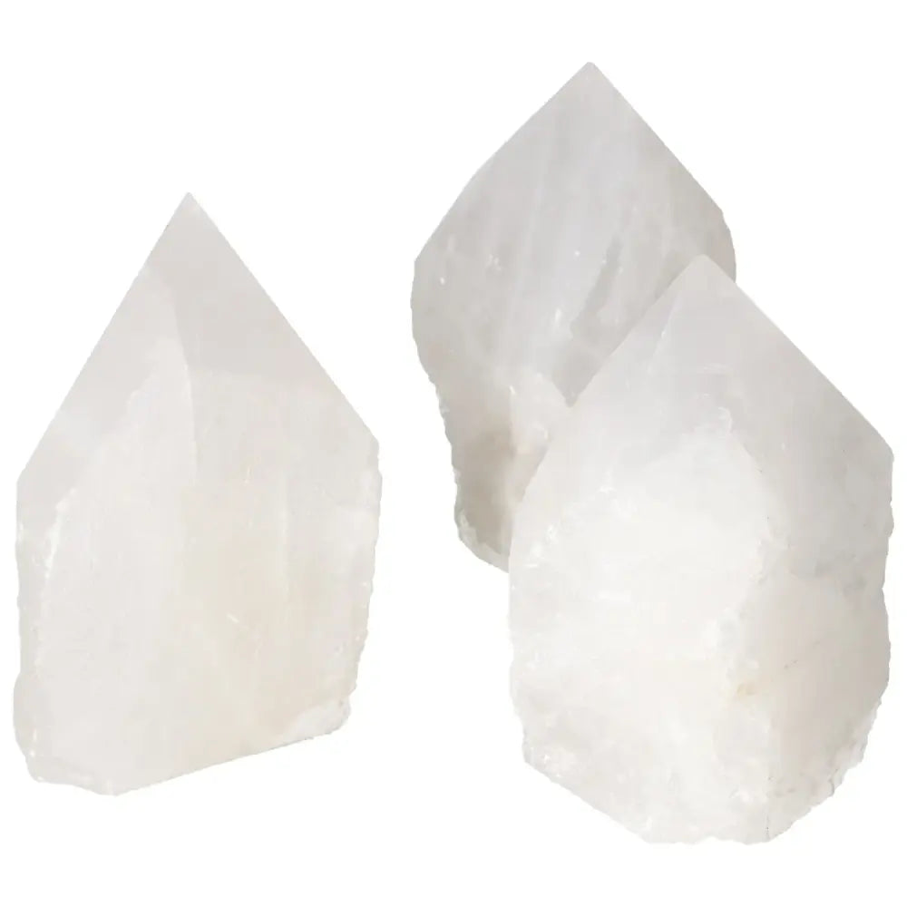 Set of polished point quartz crystals from Sylvia Crystals, renowned for premium quality and powerful purification properties.