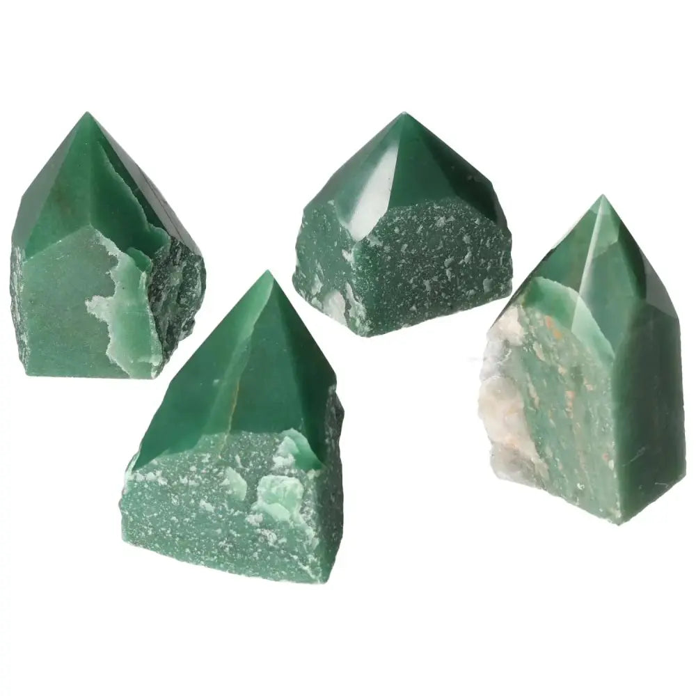 Set of four polished green quartz points from Sylvia Crystals, showcasing natural beauty and elegance.