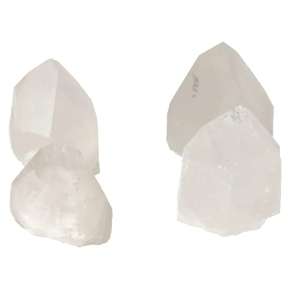 Four polished point quartz crystals from Sylvia Crystals, ideal for spiritual alignment and chakra connection.