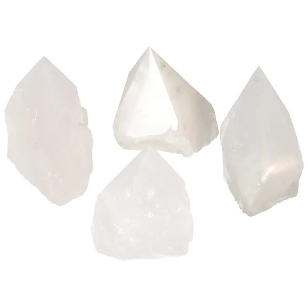 Four polished point quartz crystals from Sylvia Crystals, enhancing well-being and creating a serene environment with natural purity and strength.
