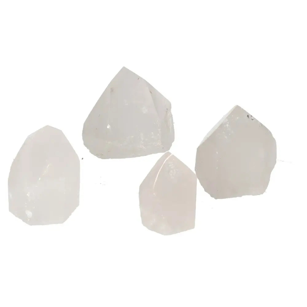 Collection of polished point quartz crystals exuding luxury and spiritual energy, ideal for enhancing living spaces.