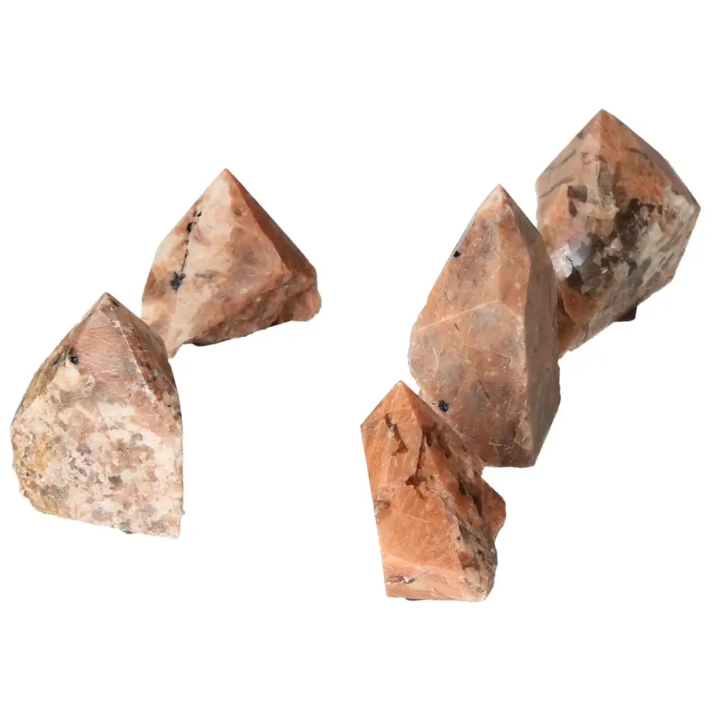 Polished Point Quartz with Feldspar crystals from Sylvia Crystals, showcasing a blend of creativity-enhancing and balancing minerals.