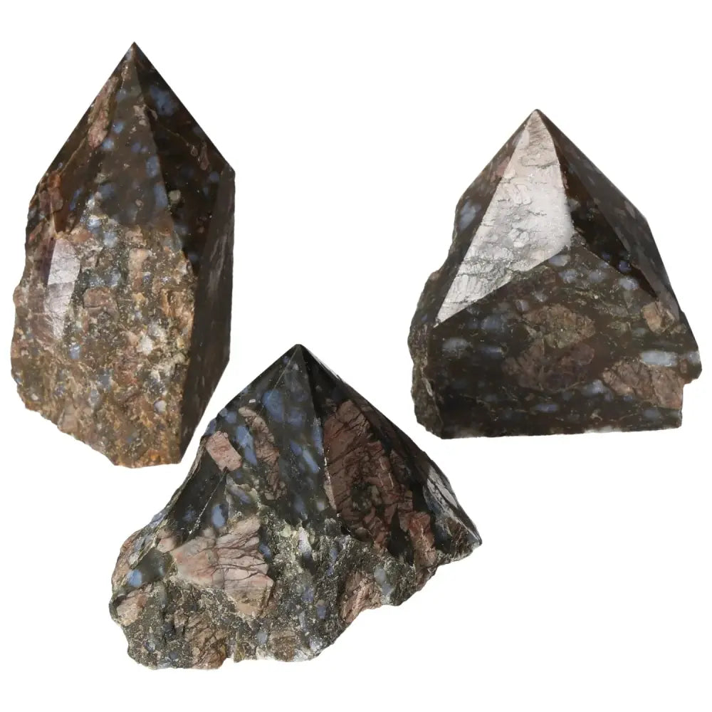 Polished Point Rhyolite L crystals showcasing pink, green, brown, and gray patterns – a Sylvia Crystals unique masterpiece.