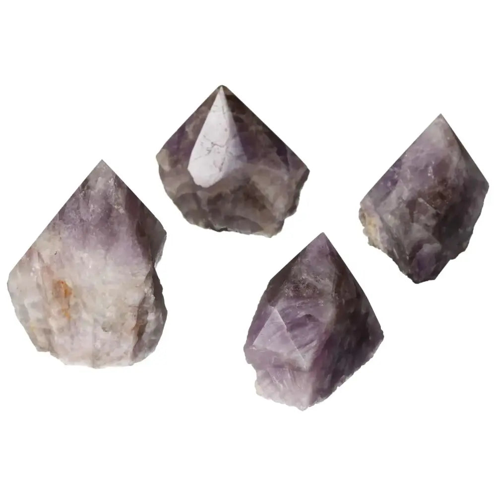 Four polished Super Seven Amethyst crystals with deep purple hues and intricate patterns, showcasing luxury and spiritual elegance.