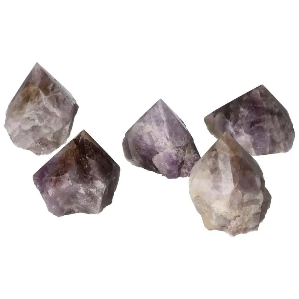 Five polished Super Seven Amethyst crystals from Sylvia Crystals, showcasing their vibrant purple hues and energy-enhancing properties.