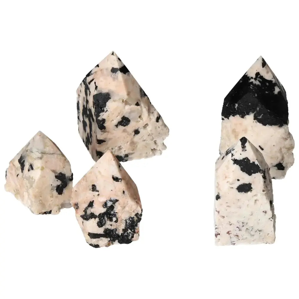 Polished point Tourmaline with Feldspar crystals showcasing exquisite craftsmanship and distinct black and white patterns.