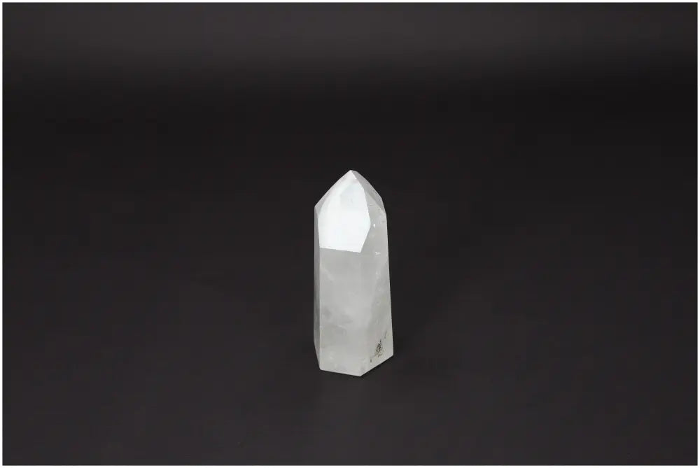 Polished Quartz Obelisk by Sylvia Crystals, a luxurious and elegant centerpiece enhancing aesthetic and spiritual ambiance.