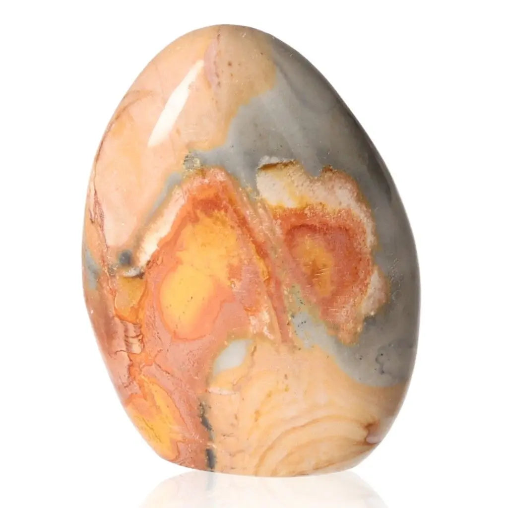 Polychrome Jasper Free Form stone featuring vibrant red, orange, and yellow hues, known as Desert Jasper, on a white background.
