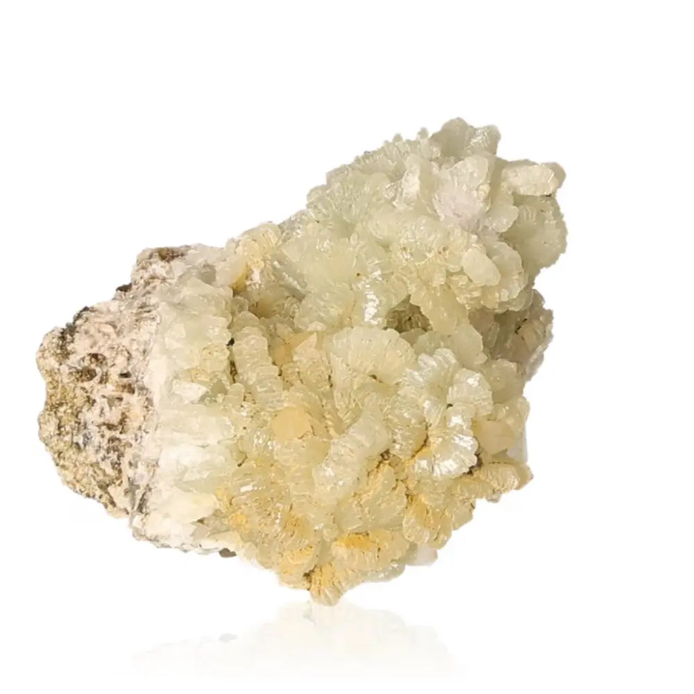 Prehnite druzy gemstone with pale yellowish-green crystals, known for soothing properties and enhancing spiritual growth.