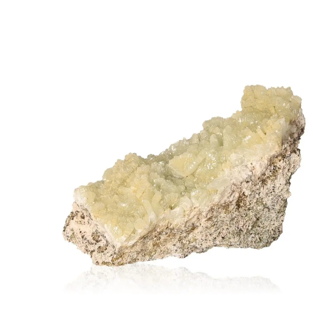 Prehnite Druze gemstone with pale green crystals, known for promoting inner peace and spiritual growth.