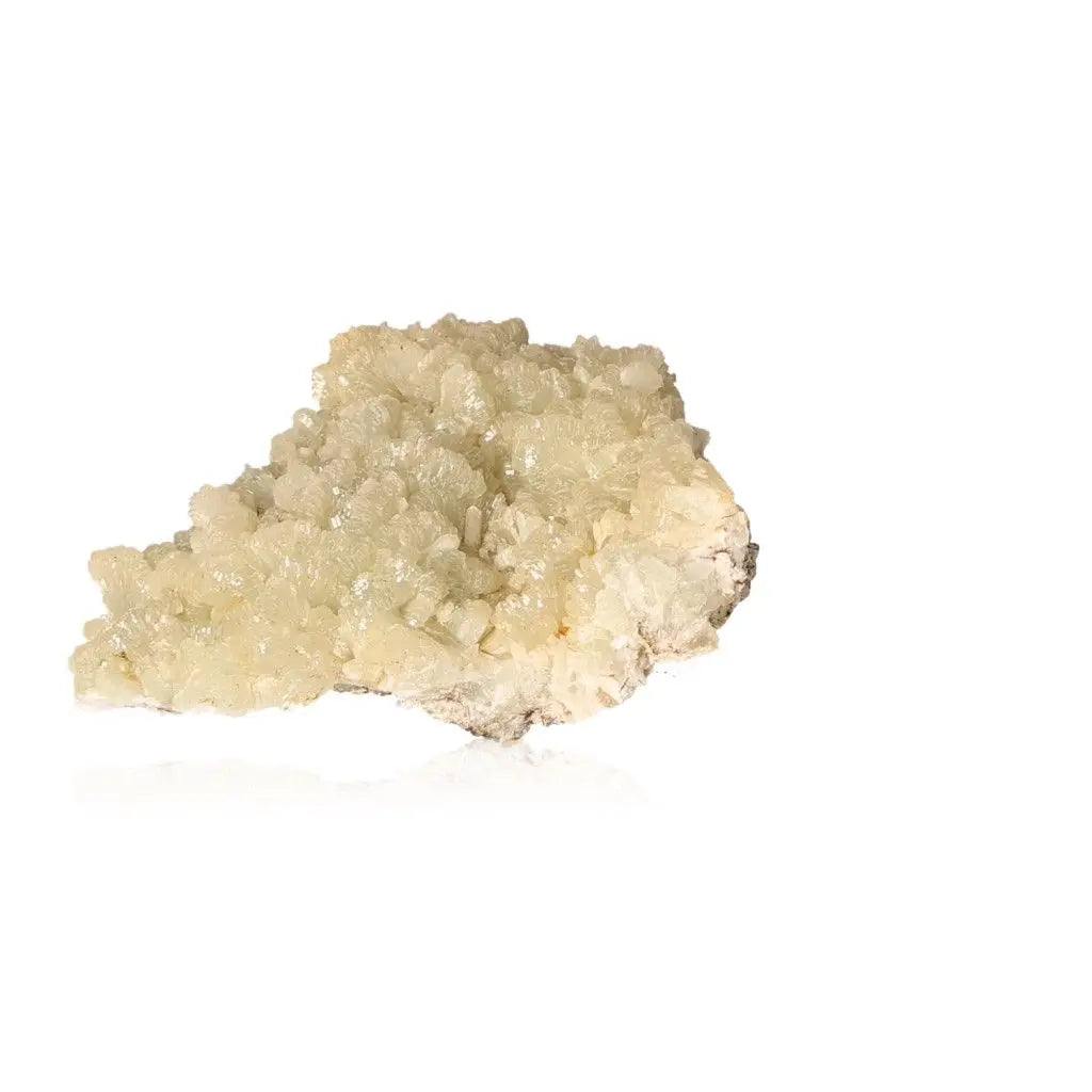 Pale yellowish-green Prehnite druzy gemstone promoting harmony and spiritual growth on a white background.