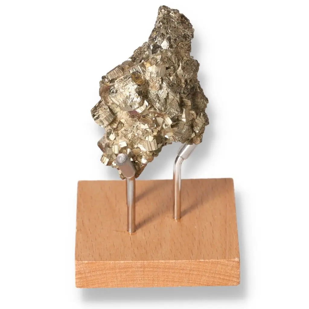 Natural pyrite mineral specimen with golden hue on a wooden base, known for its metallic luster and resemblance to gold.