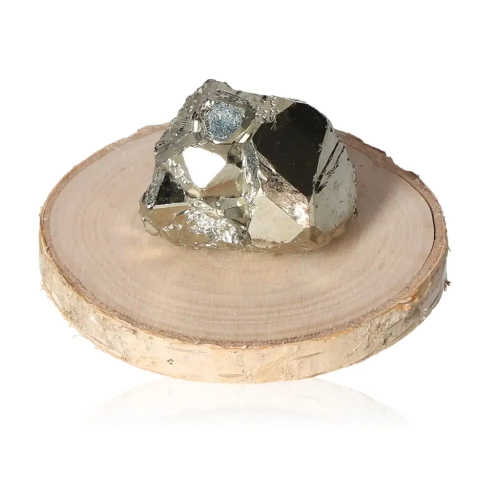 Pyrite druzy on wooden display, showcasing metallic luster and golden hue, symbolizing abundance and prosperity.