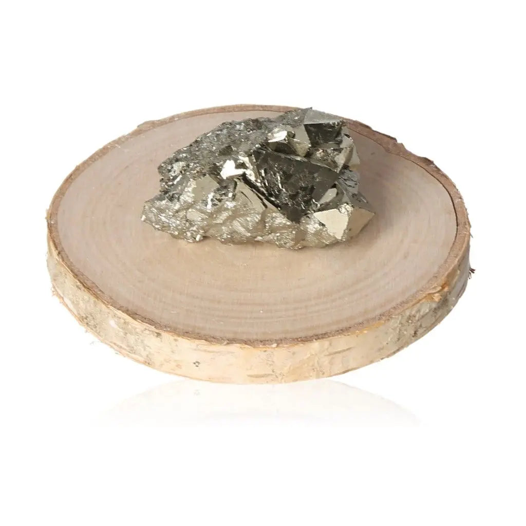 Pyrite druze with metallic luster on wooden slab, symbolizing abundance and prosperity, known as Fool's Gold. Ideal for wealth attraction.