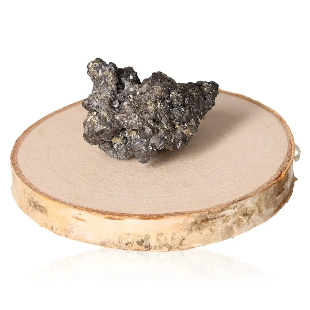 Pyrite druze on wooden disc, showcasing its metallic luster and golden hue, symbolizing abundance and prosperity.