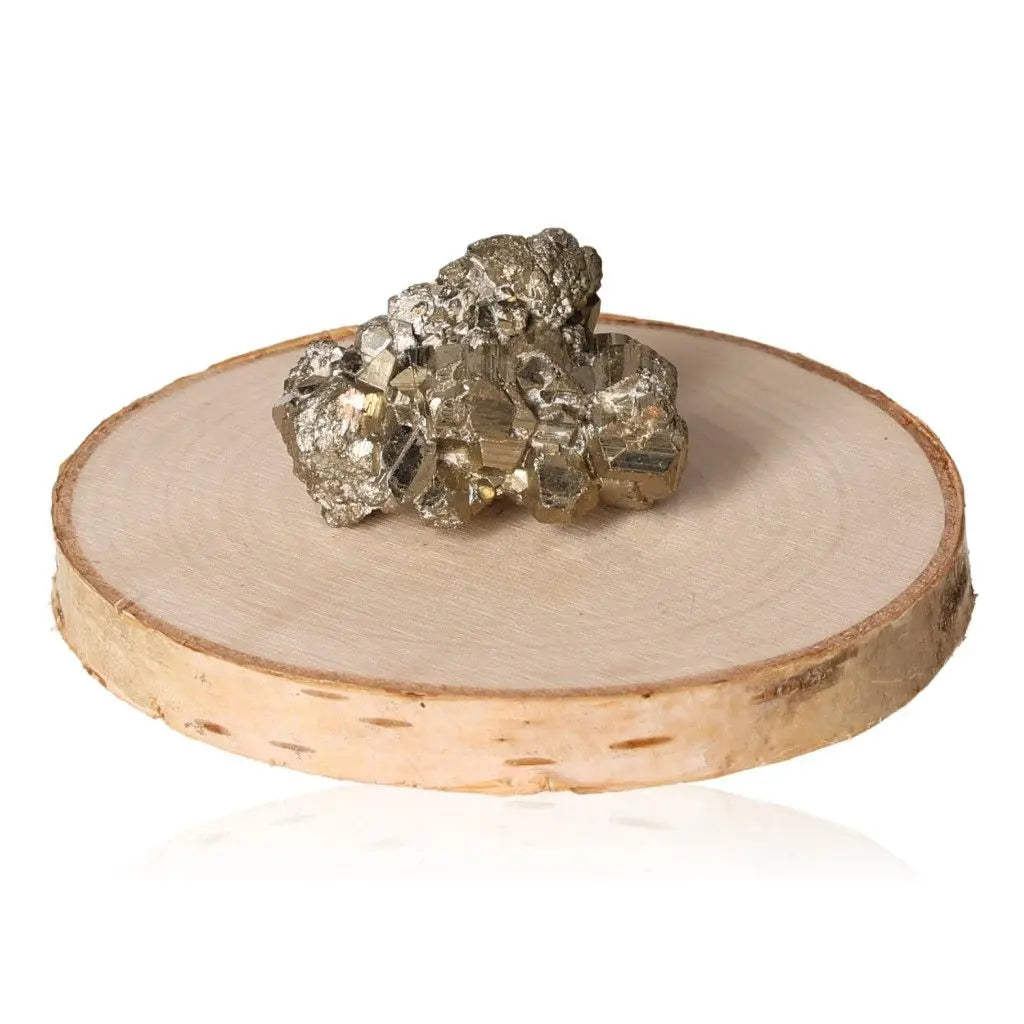 Pyrite druzy crystal on wooden display, showcasing its golden hue and metallic luster. Perfect for attracting wealth and success.