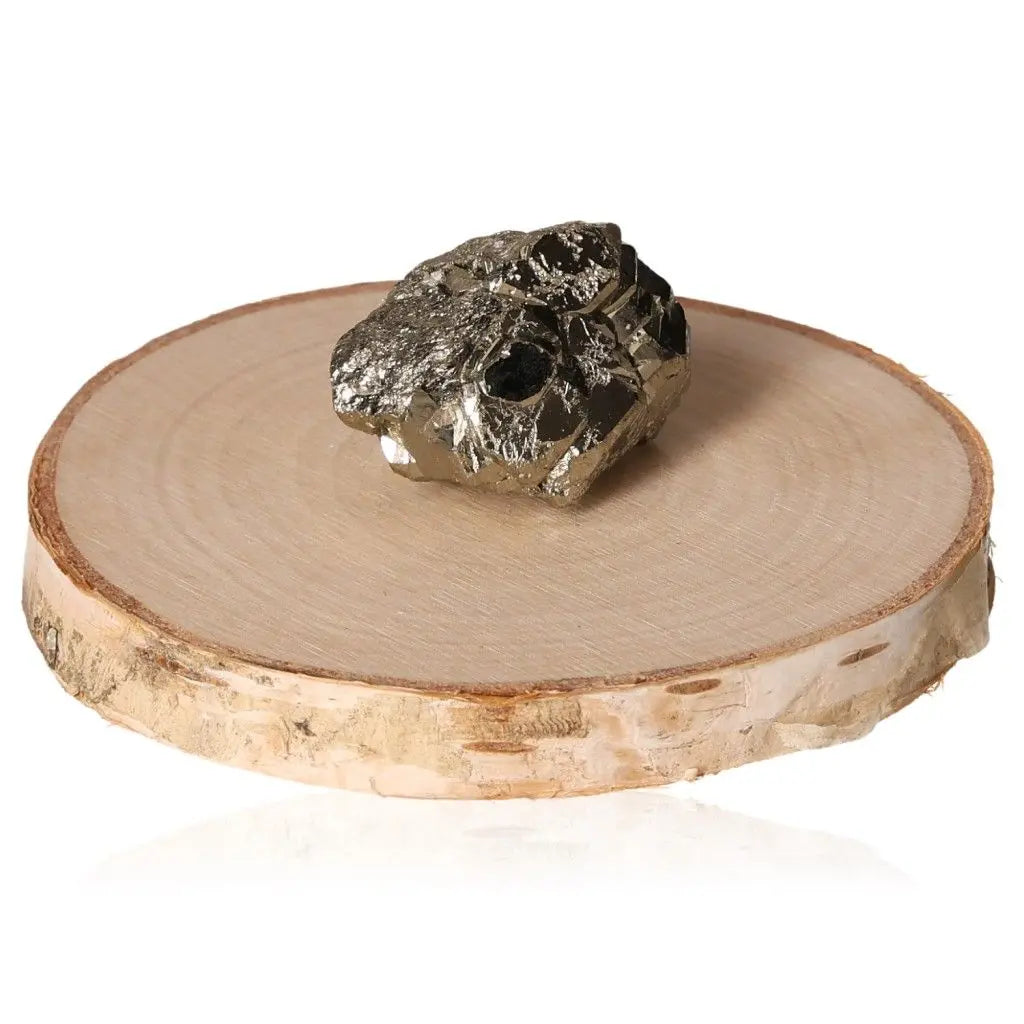 Pyrite druze on a wooden base, showcasing its metallic luster and golden hues, symbolizing wealth and prosperity.