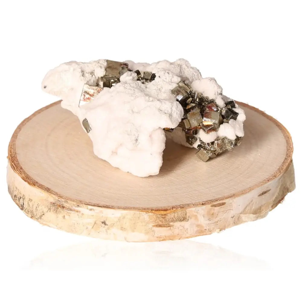 Pyrite druzy mineral on wooden base, showcasing golden hue and metallic luster. Symbol of wealth, success, and prosperity.