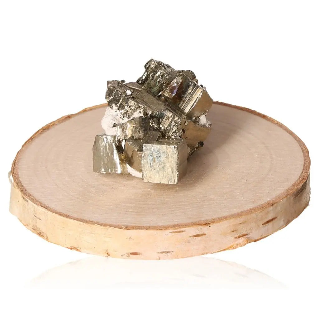 Pyrite druzy cluster on a rustic wooden display, showcasing its metallic luster and golden hue, often called Fool's Gold.