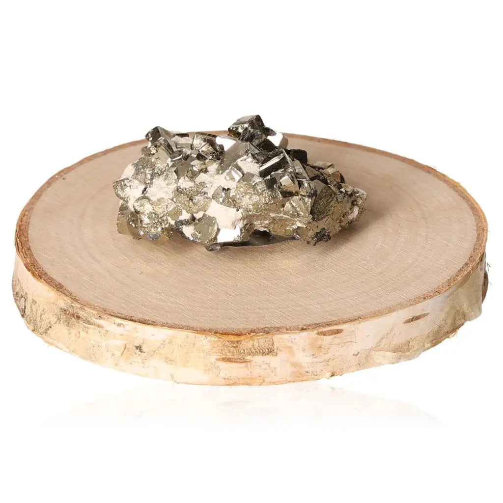 Pyrite druze with radiant gold color on wooden base, showcasing metallic luster and wealth-attracting properties.