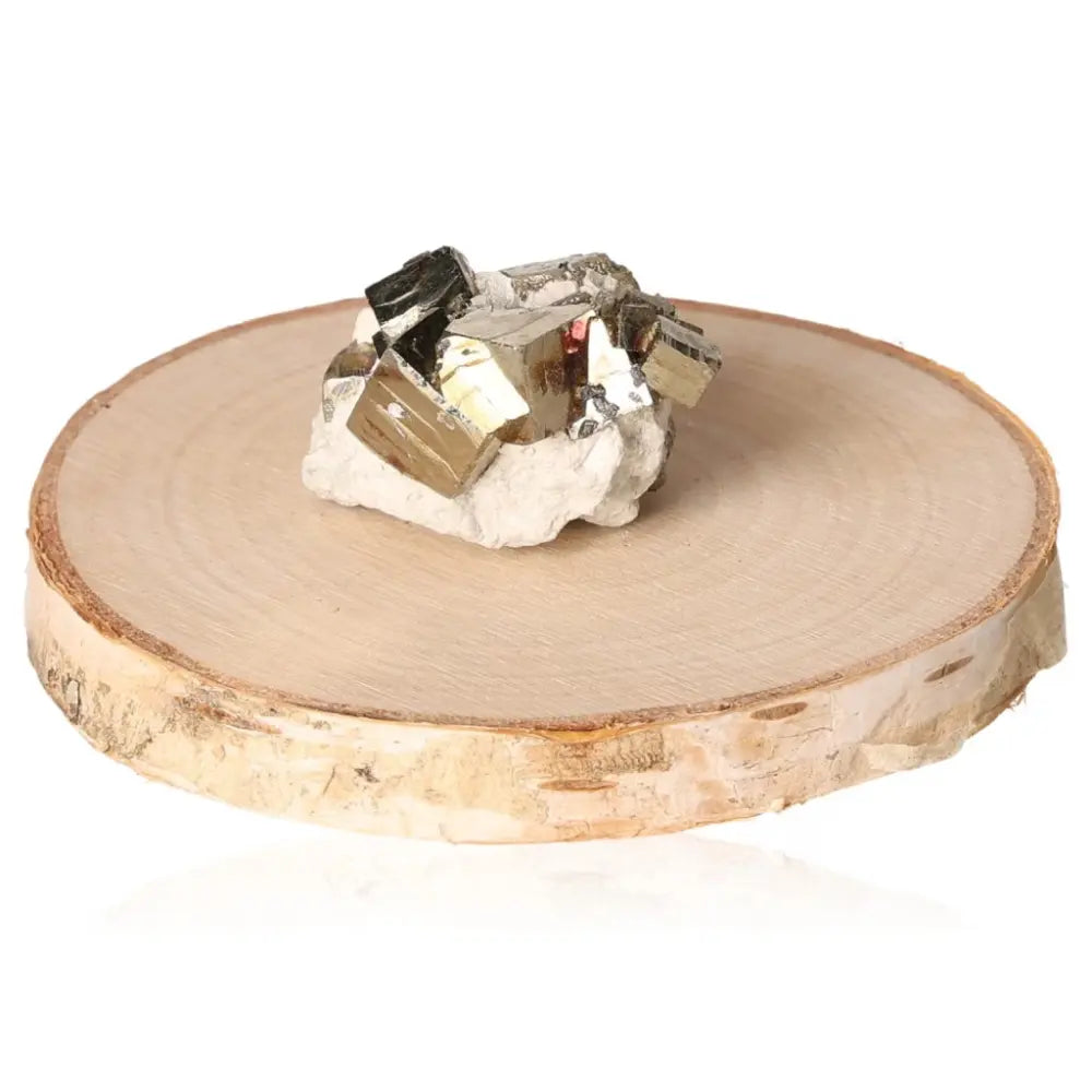 Pyrite druze on wooden slice, showcasing its metallic luster and natural charm, often called Fool's Gold for its resemblance to real gold.