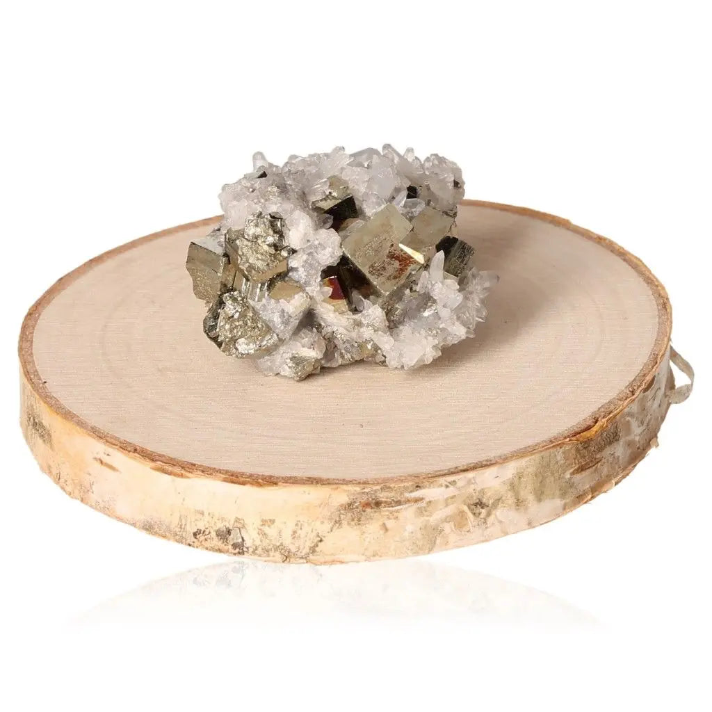 Pyrite druzy crystal with metallic luster on wooden base, symbolizing abundance and prosperity.