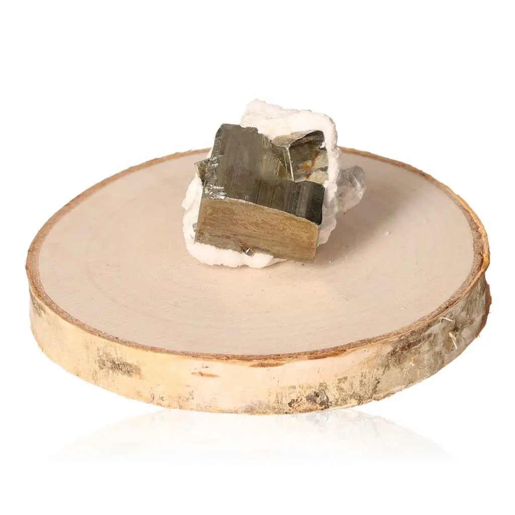Pyrite druzy on wooden slab, showcasing its golden hue and metallic luster, symbolizing wealth and prosperity.