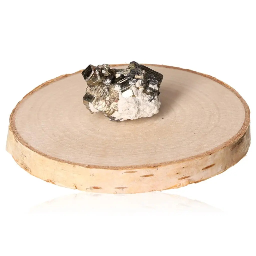Pyrite druze stone on a wooden base, showcasing its radiant golden hue and metallic luster, symbolizing abundance and prosperity.