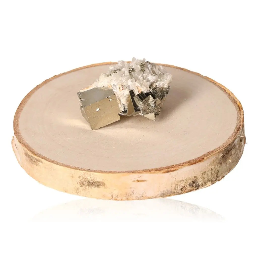 Pyrite druze with metallic luster displayed on a wooden slice, symbolizing abundance and wealth, known as Fool's Gold.