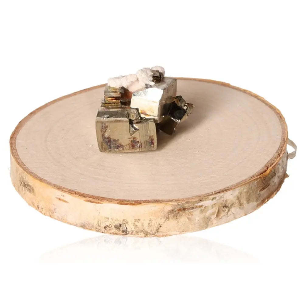 Pyrite druzy cluster on a wooden disc, showcasing its radiant golden hue and metallic luster, symbolizing prosperity and wealth.