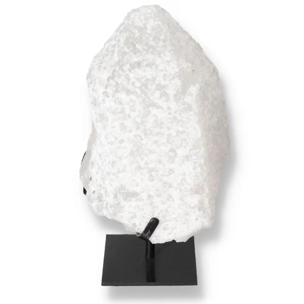 Quartz Crystal Bubble by Sylvia Crystals, showcasing stunning multicolored hues and mystical properties, elegantly displayed on a black stand.