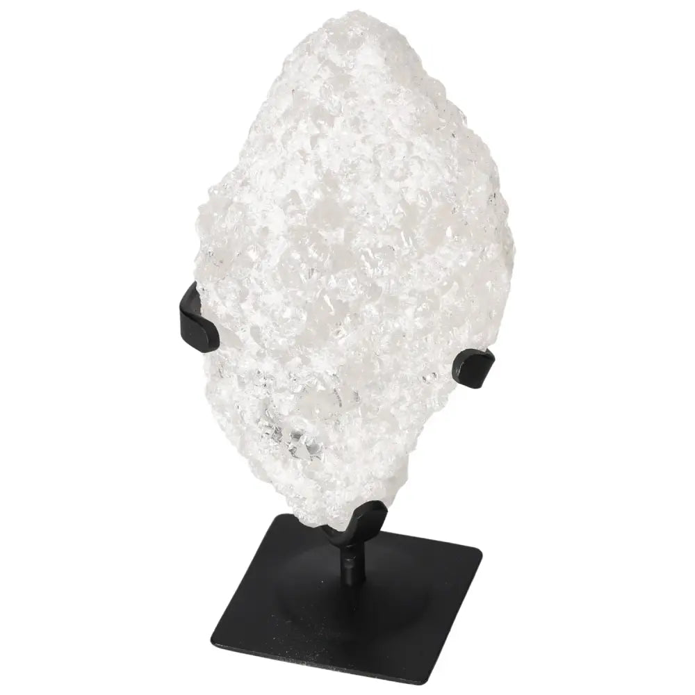 Quartz Crystal Bubble by Sylvia Crystals on a black stand, showcasing its clarity and modern design, enhancing spiritual serenity.