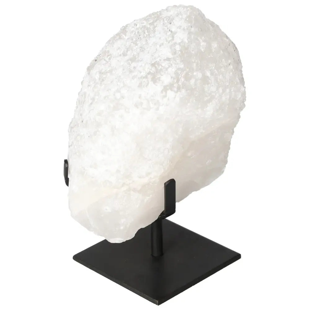 Quartz Crystal Bubble on display stand from Sylvia Crystals, showcasing its multifaceted structure and energetic properties.
