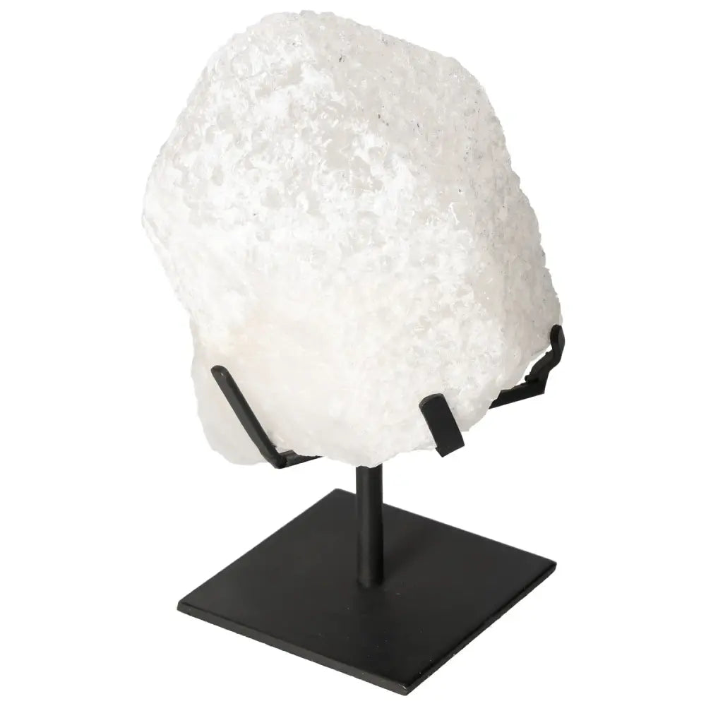 Quartz Crystal Bubble on display stand from Sylvia Crystals, showcasing multifaceted structure and energetic properties.